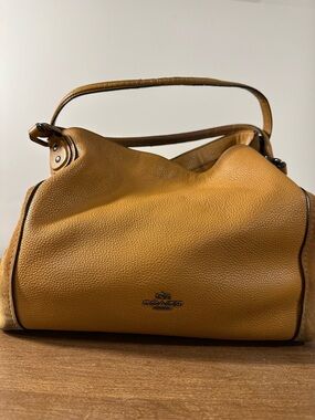 Coach Edie 31 shoulder bag crafted from Pebbled Leather and Suede.